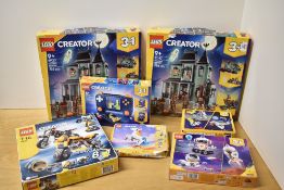 A collection of seven construction sets from the LEGO Creator series, predominantly featuring 3-in-1