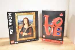 A pair of LEGO Art series construction sets manufactured from plastic building bricks. The