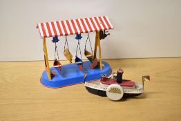 This lot features a pair of vintage tinplate mechanical toys of German origin. The first item is a