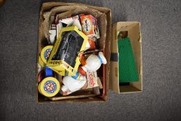 A collection of vintage toys including character-themed items, a vehicle, and construction blocks.