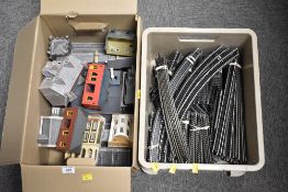 An assortment of OO gauge model railway layout components and scenery, contained within two