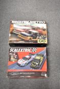 A pair of boxed electric slot car racing sets manufactured by Scalextric. The first set is the Spa