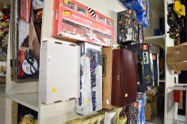 This group of collectible toys features two specific Corgi die-cast vehicle sets. The first is a