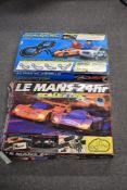 Two boxed Scalextric electric slot car racing sets of plastic construction. The first set, Le Mans