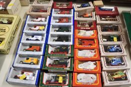 A collection of die-cast model vehicles from manufacturers including Lledo, Corgi, and Matchbox. The