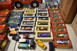 A large collection of vintage-style die-cast model vehicles featuring examples from Lledo, Corgi,