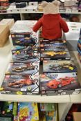 A collection of eight plastic construction building sets from the Speed Champions range,
