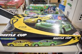 A Scalextric Beetle Cup electric slot car racing system featuring Volkswagen New Beetle cars. The