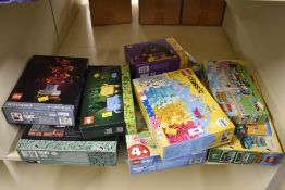 A collection of eight construction sets predominantly manufactured by LEGO, all contained within