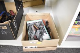 A collection of vintage model railway locomotives, rolling stock, and track components, primarily