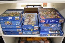 This collection consists of approximately 11 boxed jigsaw puzzles, primarily manufactured by the