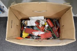 An assortment of vintage construction toy components, primarily attributed to the manufacturer