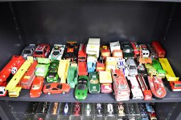 A diverse collection of toy vehicles comprising various types, scales, and manufacturers,