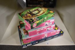 A collection of four factory-sealed LEGO construction sets, primarily from the Wicked series. The