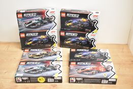 A collection of eight LEGO Speed Champions construction sets, each featuring official Formula 1 team
