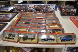 A collection of die-cast vehicles and building sets comprising a group of Matchbox Models of