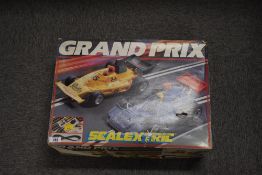 A vintage Scalextric Grand Prix electric slot car racing set from the 1980s. The set is housed in