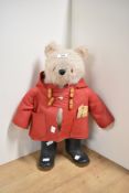 This is a vintage plush teddy bear of the character Paddington, manufactured by Gabrielle Designs L