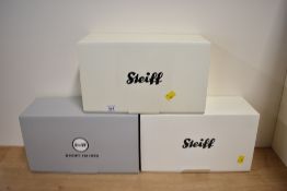 A trio of collectible teddy bears manufactured by Margarete Steiff GmbH. The collection includes