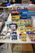 A collection of vintage die-cast metal and plastic vehicles and toys, primarily featuring models