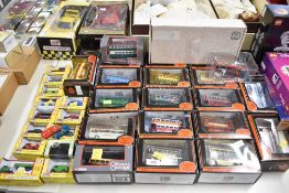 A large and varied collection of boxed die-cast model vehicles, primarily focusing on British public