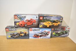 A collection of LEGO Speed Champions plastic construction sets, each representing a specific