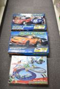 Three Scalextric electric slot racing sets comprising one Micro Scalextric set and two 1:32 scale