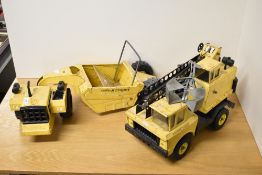 A pair of vintage pressed steel construction toys manufactured by Tonka. The lot includes a Mighty