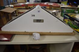 A contemporary double-sided illuminated tabletop sign of triangular prism form, likely originating