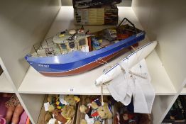 A collection of model vessels and a boxed racing set. The lot features a large-scale model fishing