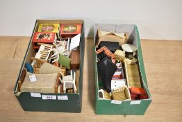 A large collection of vintage dollhouse furniture and miniature accessories, primarily of mid-20th-