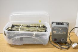 This lot features a collection of Hornby Dublo 3-rail model railway track accompanied by a Meccano