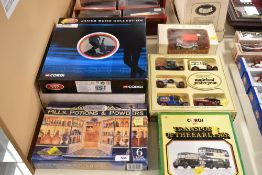 This collection comprises multiple boxed die-cast toy vehicle sets and individual models from
