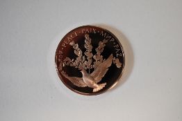 A 1980 United Nations Bronze Peace Medal, Obv Peace Dove, Rev United Nations Logo, Encapsulated In A