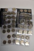 A Collection Of Two Pound Coins, Displayed In Plastic Sleeves And Housed In a Folder, (64)
