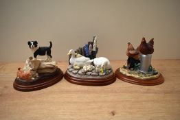 A group of three Border Fine Arts animal groups comprising 'Settle Down' model number A2680 designed