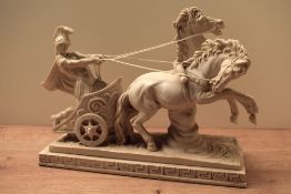 A 20th century reproduction resin figure group depicted a Roman chariot with a gladiator or