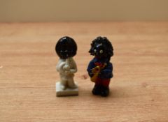 A 20th century heavy cast painted metal Robertson Jam band member measuring 7cm tall sold