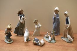 A group of eight Lladro and Nao by Lladro porcelain figures and studies to include 'Ducklings' model