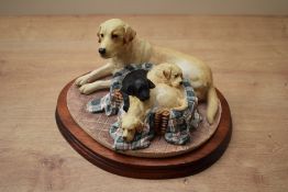 A limited edition Border Fine Arts animal group 'Labrador & Pups' model number B0350A, designed by M