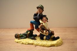 A 20th century pottery political figure group depicting Tony Blair, George H.W. Bush and Saddam