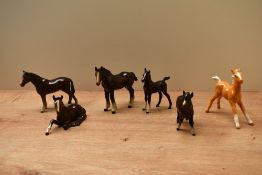 A group of six Beswick Pottery foal studies to include 'Foal' (Lying) model number 915 and 'Shetland