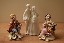 A Royal Doulton bone china Images series figure group 'Bride and Groom' HN 3281 sold together with