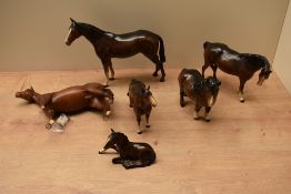 A group of six Beswick Pottery horse studies to include Foal (Lying) model number 915 designed by