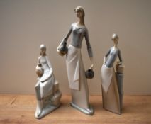 A group of three Nao by Lladro porcelain figurines comprising 'Girl Shepherd on Rocks', 'Girl with