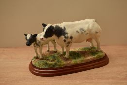 A Border Fine Arts animal group study 'Belgian Blue Cow & Calf' model number A1252, designed by