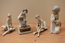 A group of four Lladro and Nao by Lladro and similar porcelain figurines to include 'Flower