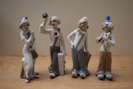 A group of four Casades Spanish porcelain clown figures to include two band members, a violinist and