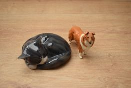 A Royal Copenhagen porcelain animal study 'Sleeping Tabby Cat', model number 422 measuring 8cm