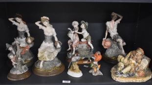 A group of six Capodimonte style figures/figurines depicting fruit pickers, a tramp, farmer and